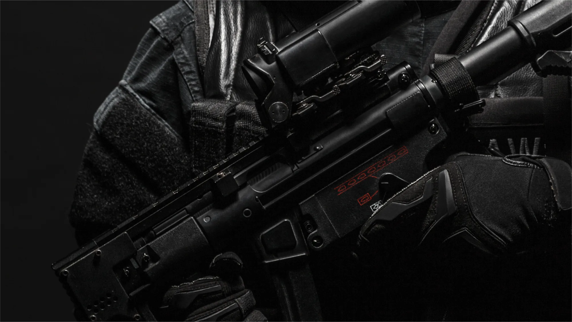 Close-up of a rifle and tactical range gear
