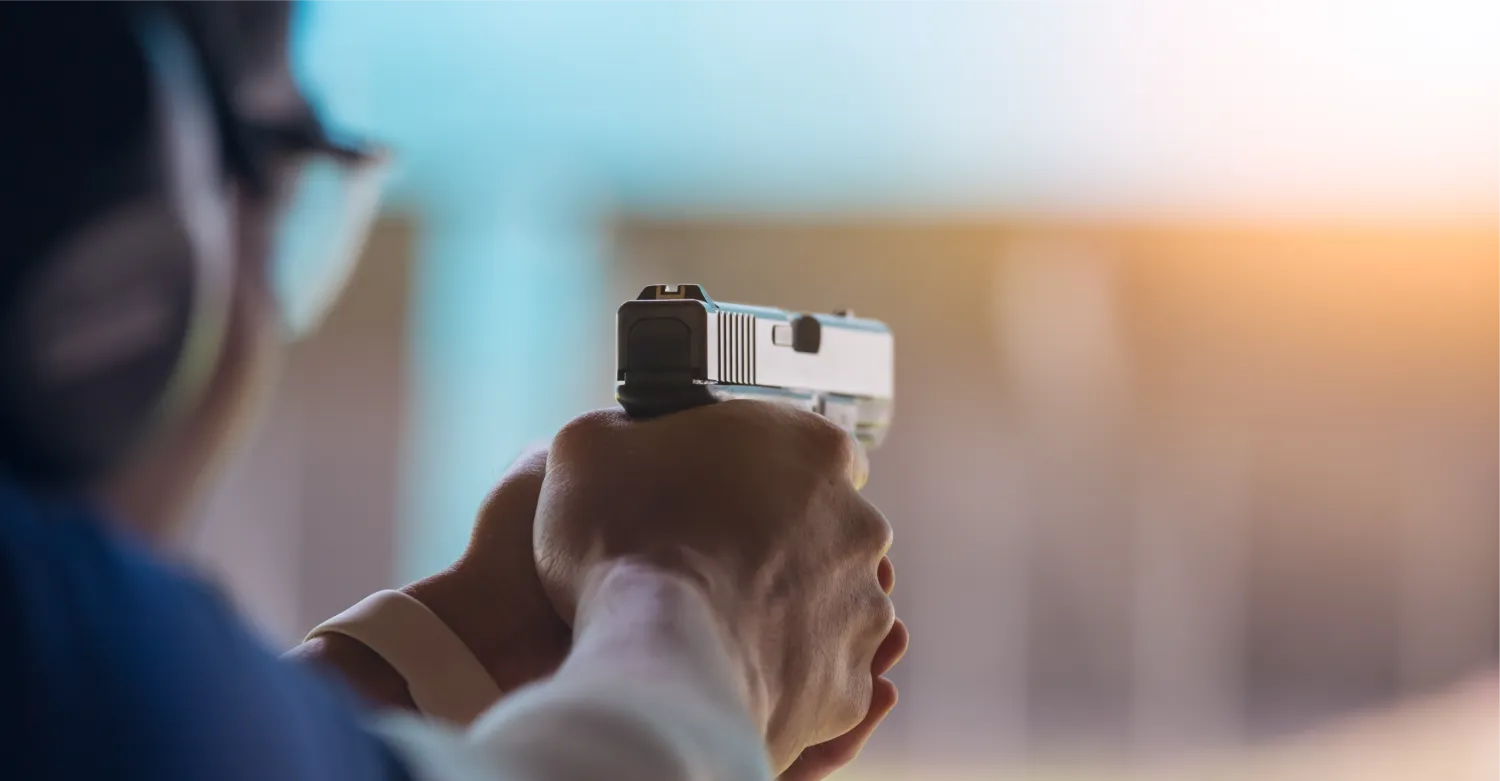 Range 313 staff assisting a shooter in an indoor lane